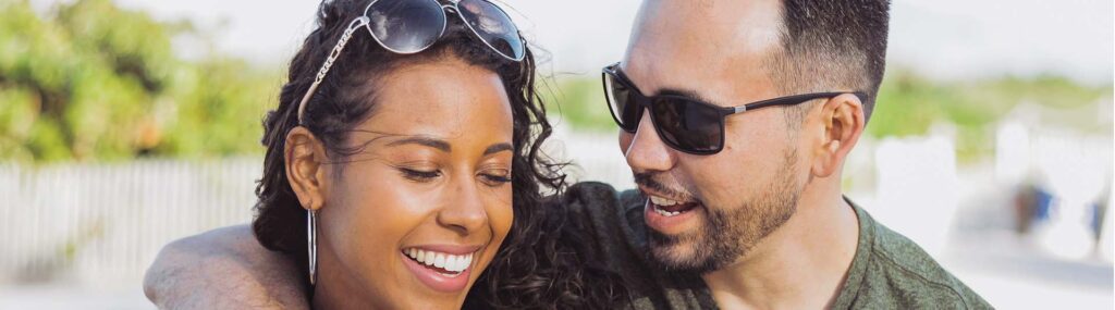 A couple embrace as they smile with one another. This represnts the support couples therapy and marriage counseling in West Des Moines, IA can have. Learn more about online marriage counseling from a couples therapist in West Des Moines, IA today. 50266