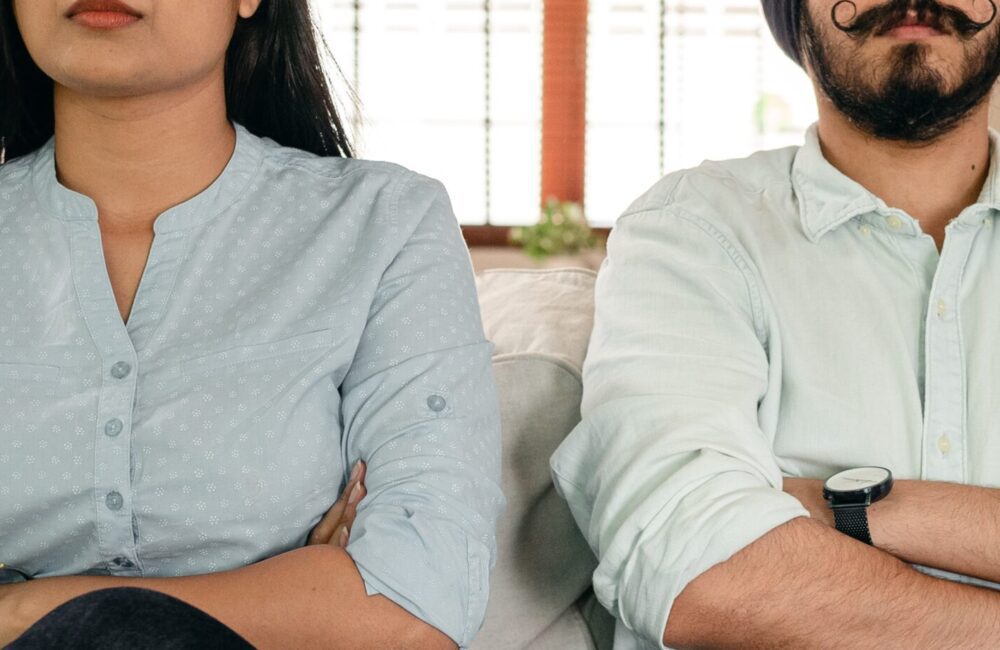 A couple sit next to one another with crossed arms looking forward. A discernment counselor in West Des Moines, IA can help you make the right decision for your relationship. Learn more about divorce counseling in West Des Moines, IA today by contacting a divorce counselor. 50266