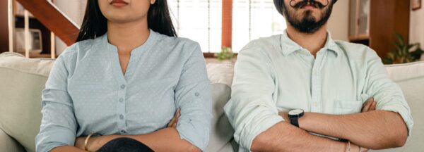 A couple sit next to one another with crossed arms looking forward. A discernment counselor in West Des Moines, IA can help you make the right decision for your relationship. Learn more about divorce counseling in West Des Moines, IA today by contacting a divorce counselor. 50266