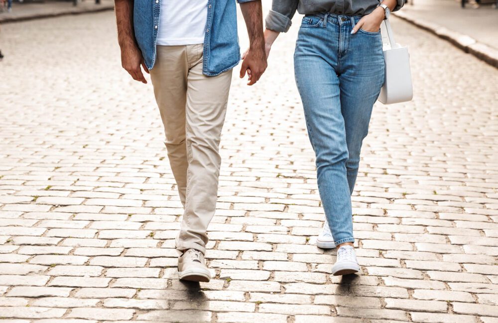 A couple hold hands to discuss realistic expectations for their relationship. In-person or online marriage counseling in West Des Moines, IA can offer support in creating stronger bonds. Contact an online couples counselor to learn more about marriage counseling in Iowa today! 50266