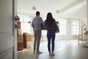 A couple hold moving boxes as they look at their new apartment. Premarital counseling in West Des Moines, IA can offer support with major transitions in a relationship. Contact a premarital counselor in West Des Moines, IA to learn more about online premarital counseling in West Des Moines, IA today! 50266
